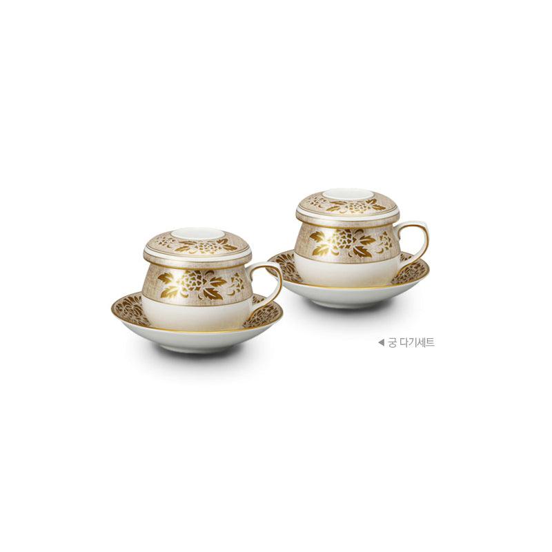 Gung eight-piece tea set with two covered cups and saucers