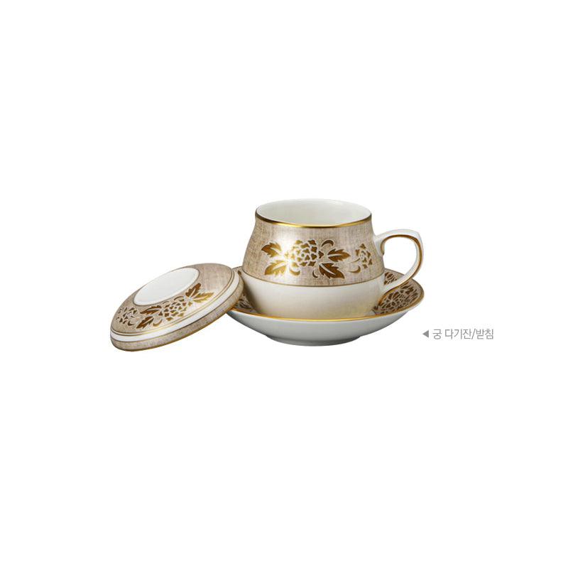 Gung tea cup, lid, and saucer with gold floral detailing