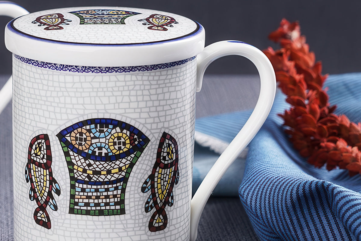 Close-up of mosaic-style Five Loaves and Two Fish mug and lid design
